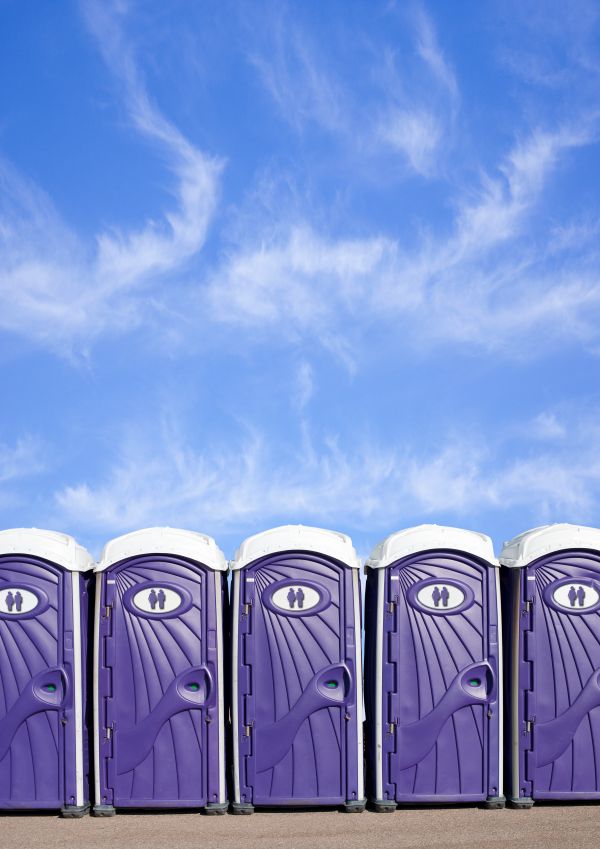 Festival porta potty rentals lined up at an outdoor event in Portland and the Pacific Northwest